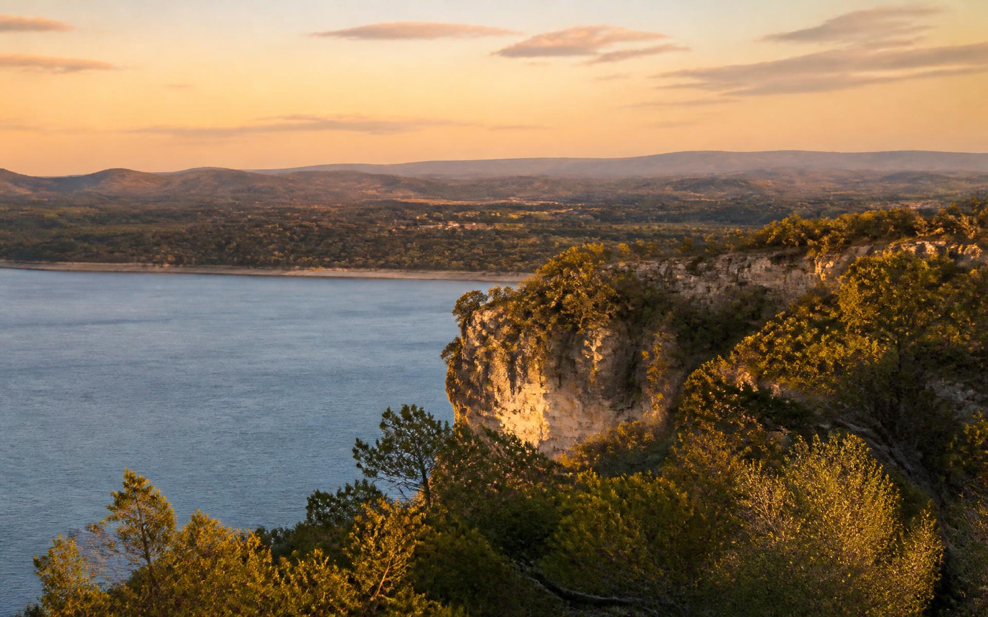 Limestone bluffs above a Central Texas lake at golden hour