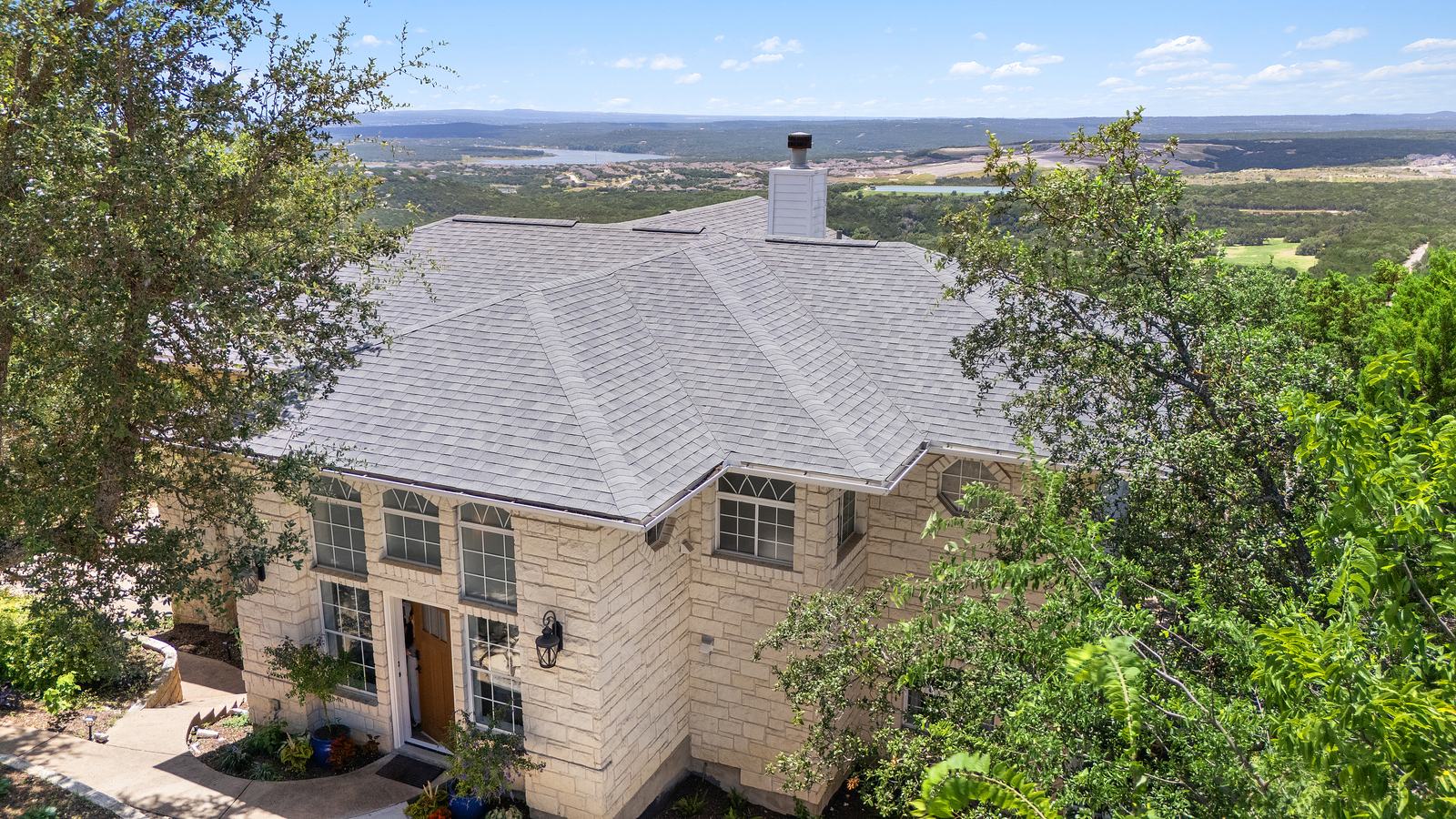 Aerial photograph showing a Central Texas home in relation to its lot and surroundings