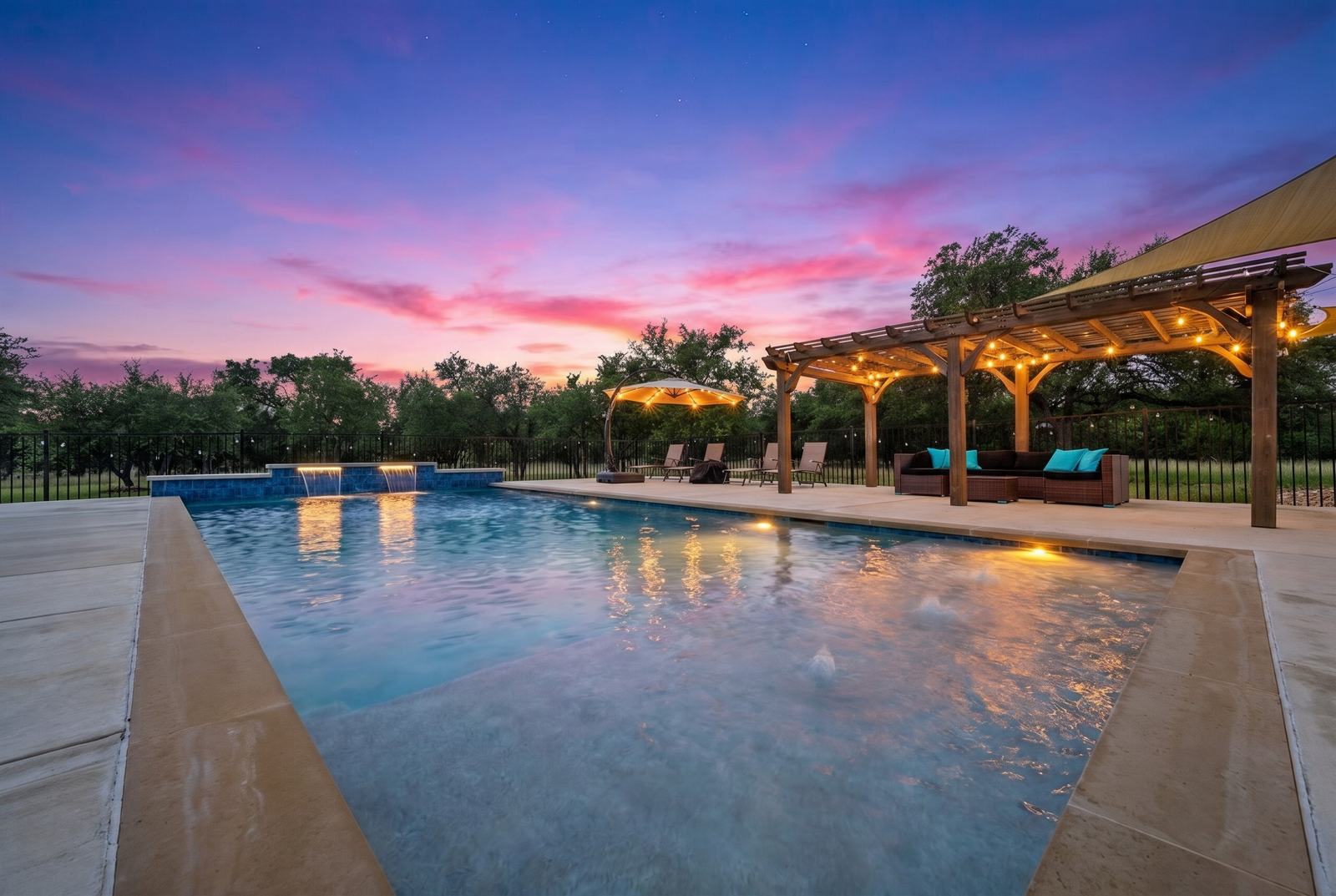 Outdoor pool and patio of a Central Texas home photographed at twilight